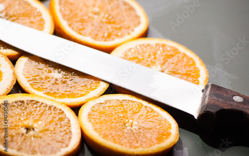 sliced orange chunks with knife