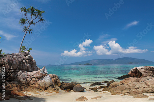 wild beach with rocks and beautiful tropical reef