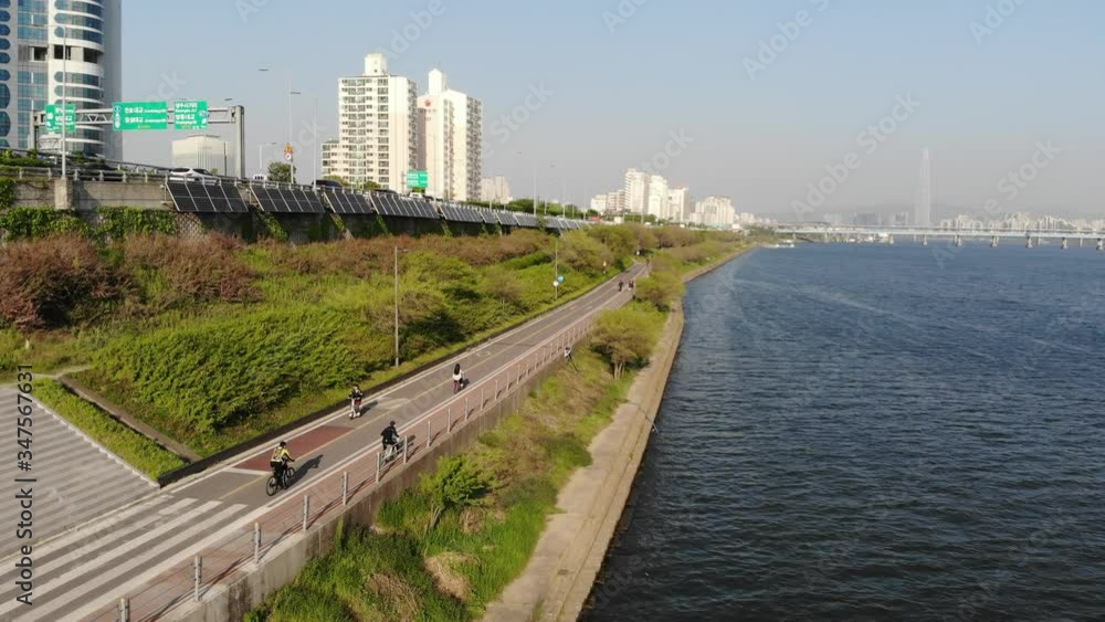 People biking by the Han River in Seoul, South Korea People biking by the Han River in Seoul, South Korea