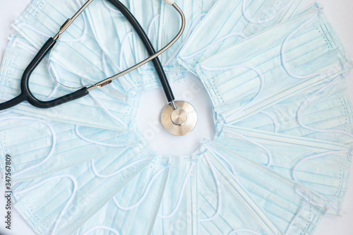 fanendoscope and blue medical masks on a white background photo