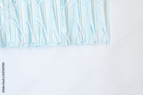 blue medical masks on a white background