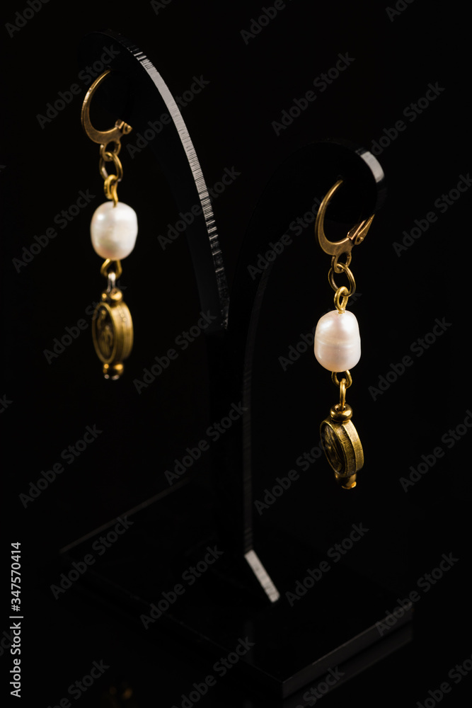 Handmade jewelry made of natural stones, isolated on black background Handmade jewelry made of natural stones, isolated on black background