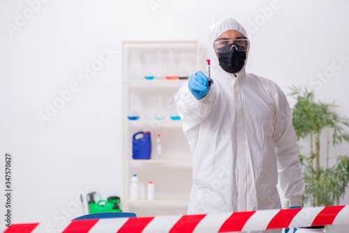 Young male chemist working in medicine lab