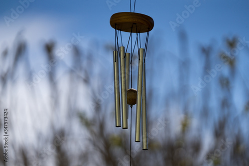Canvas Print Wind Chimes blowing in the summer air