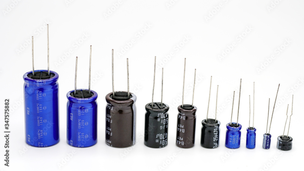 Electrolytic Capacitors Many Colors And Sizes White Background