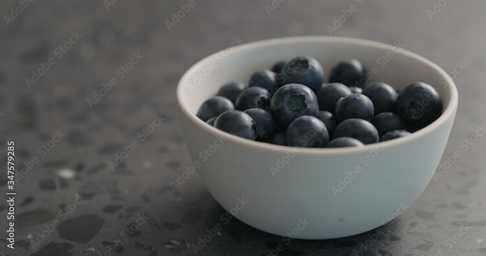 ripe blueberries in white bowl closeup ripe blueberries in white bowl closeup