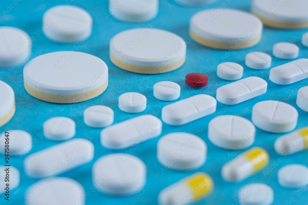 rows of pills on blue background. medicine concept or background rows of pills on blue background. medicine concept or background