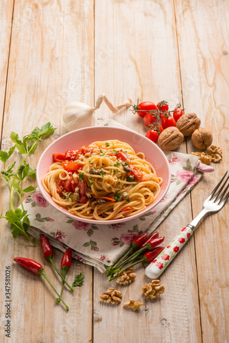spaghetti with fresh tomatoes capers garlic and nuts