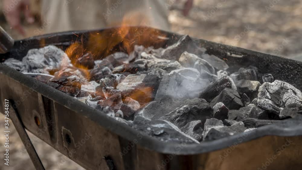 Cinemagraph of smoke on burnt coal in a BBQ grill. Close up, loop with selective focus. Cinemagraph of smoke on burnt coal in a BBQ grill. Close up, loop with selective focus.