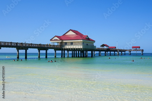 Pier over clean Blue Ocean water 