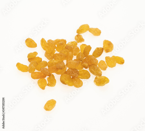 Yellow Raisins isolated on white background.