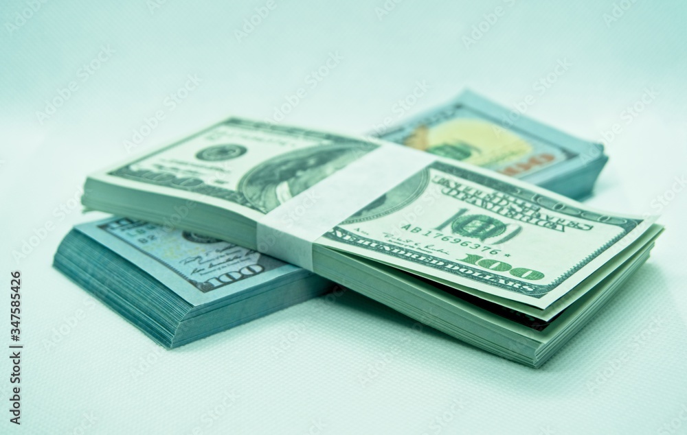 wad of 100 dollar bills in a white background wad of 100 dollar bills in a white background