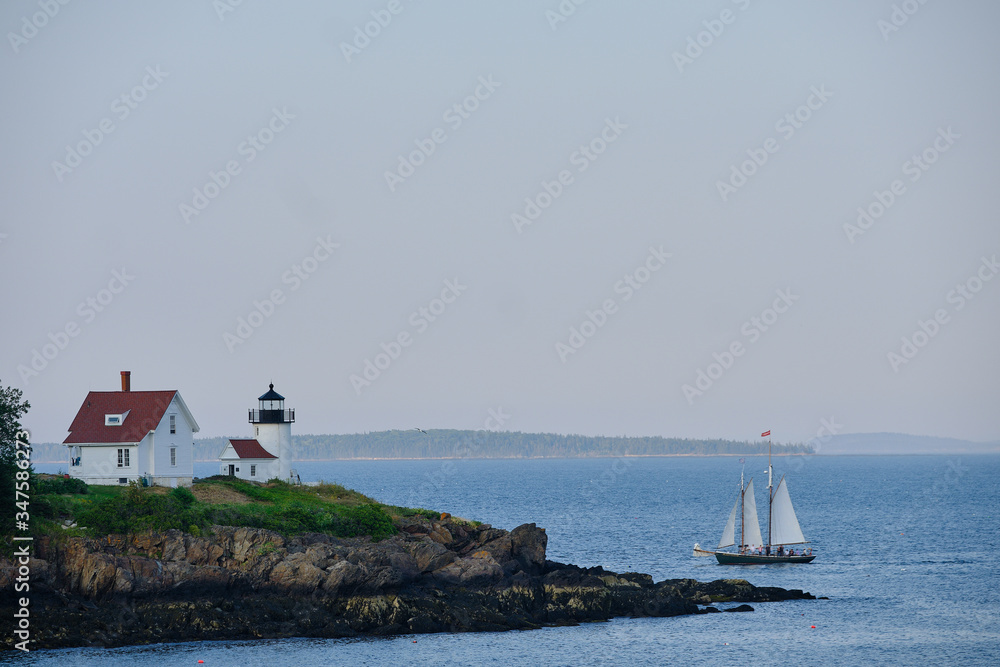 The very picturesque Curtis Island Lighthouse on the rocky shores at the entrance to Camden Harbor in Maine The very picturesque Curtis Island Lighthouse on the rocky shores at the entrance to Camden Harbor in Maine