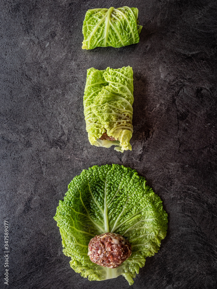 Obraz premium Kale leaves stuffed with meatballs. Overhead shot.