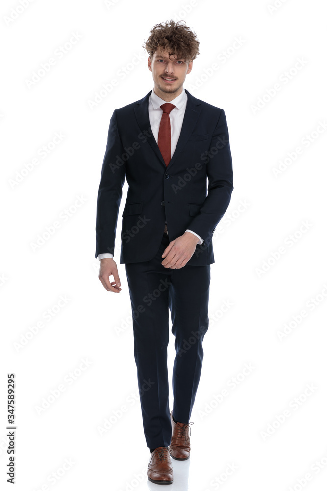 Happy businessman smiling while wearing suit Happy businessman smiling while wearing suit