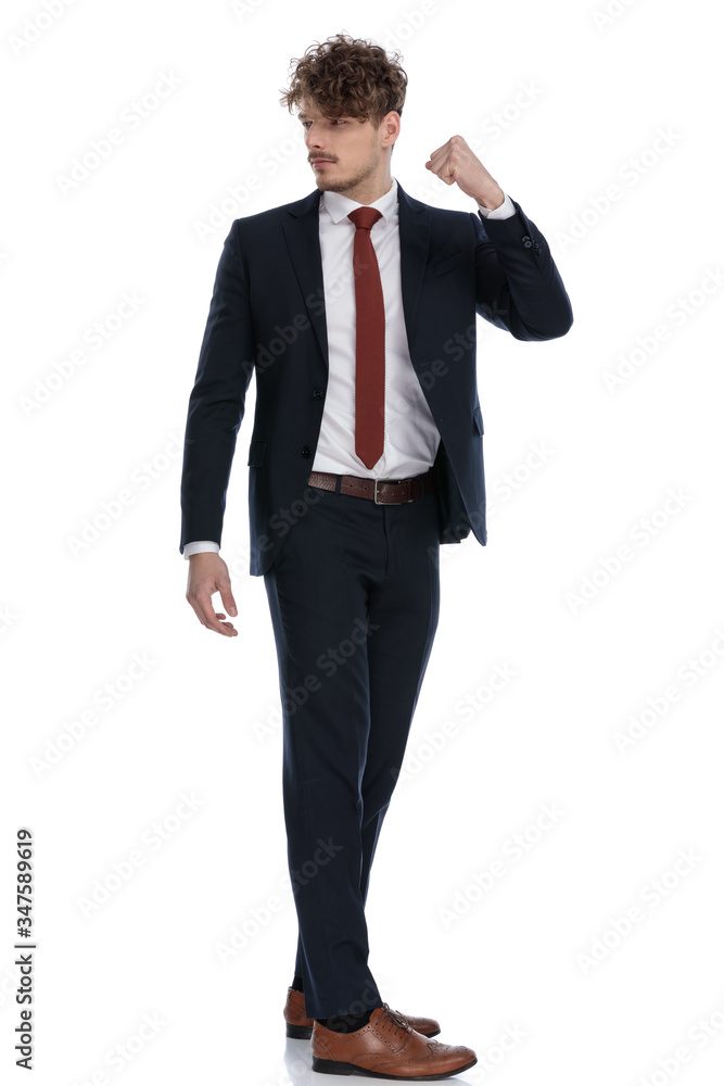 Side view of angry businessman warning with his fist Side view of angry businessman warning with his fist
