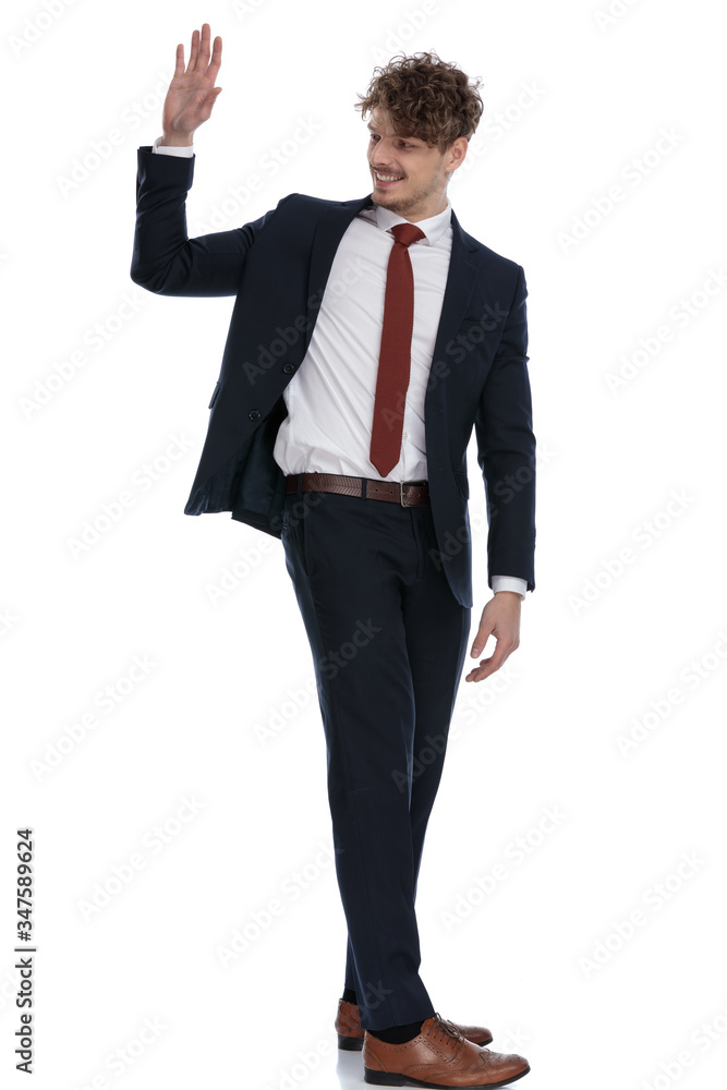 Side view of happy businessman smiling and waving Side view of happy businessman smiling and waving