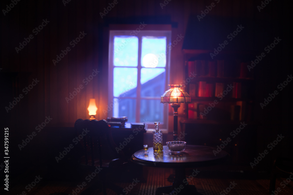 A realistic dollhouse living room with furniture and window at night. Artwork table decoration with handmade realistic dollhouse. A realistic dollhouse living room with furniture and window at night. Artwork table decoration with handmade realistic dollhouse.