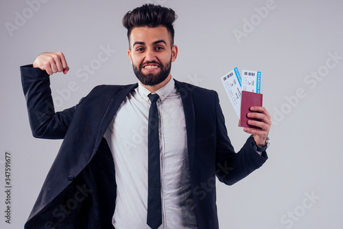indian young handsome black hair man in stylish business suit in studio isolate white background