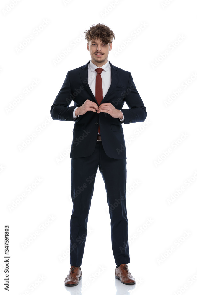 Positive businessman smiling and unbuttoning his jacket Positive businessman smiling and unbuttoning his jacket