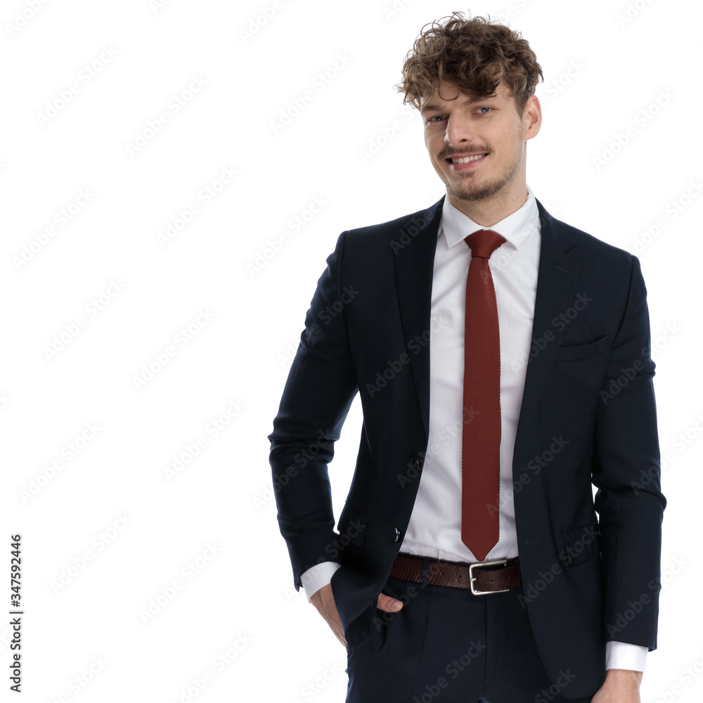 Handsome businessman smiling with hand in pocket Handsome businessman smiling with hand in pocket