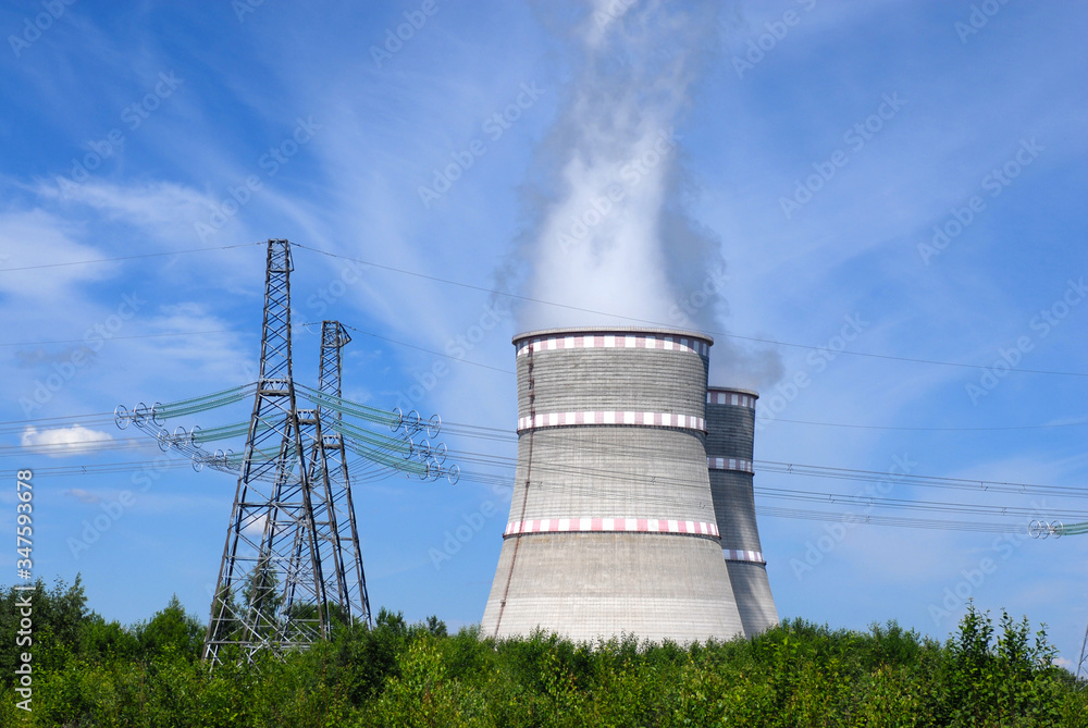 Russian Power plant with two coolers and violet flowers around it