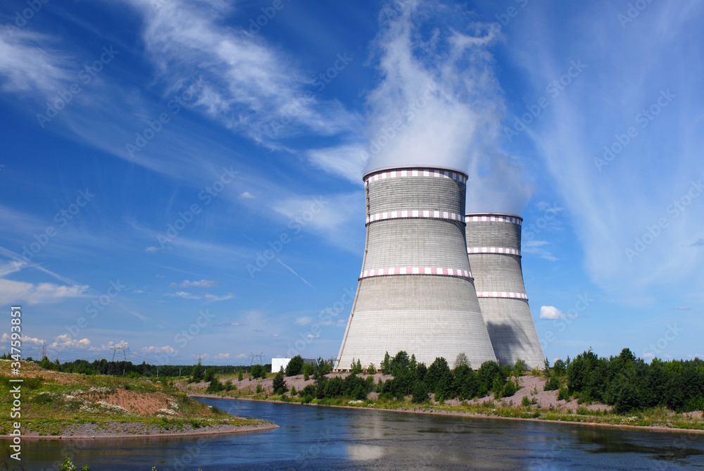 Russian Power plant with two coolers and violet flowers around it
