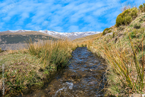 Fototapeta Naklejka Na Ścianę i Meble -  irrigation ditch in Sierra Nevada


