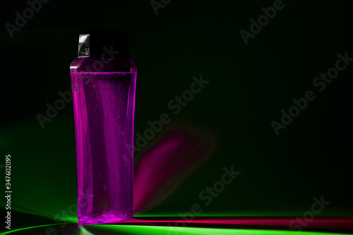 bottle with cream, shampoo for hair, shower gel, colored background, beautiful studio light, beauty and youth of the human body