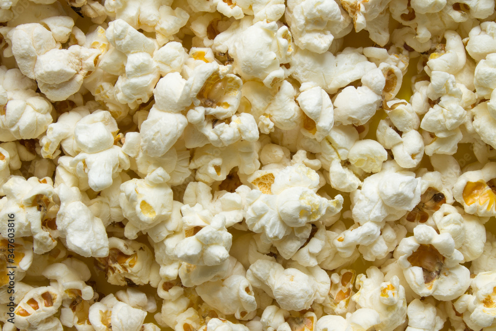 Texture background - scattered popcorn close-up and copy space