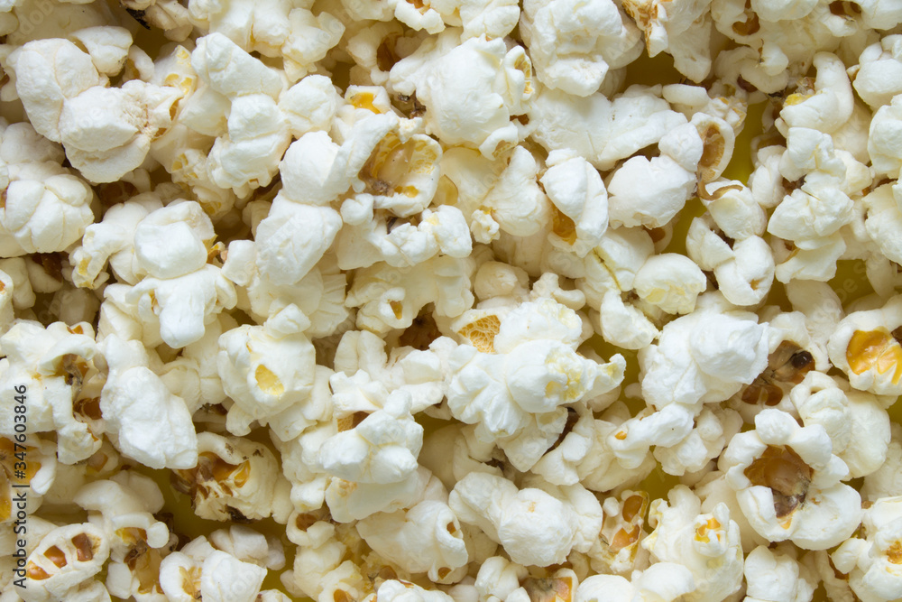 Texture background - scattered popcorn close-up and copy space