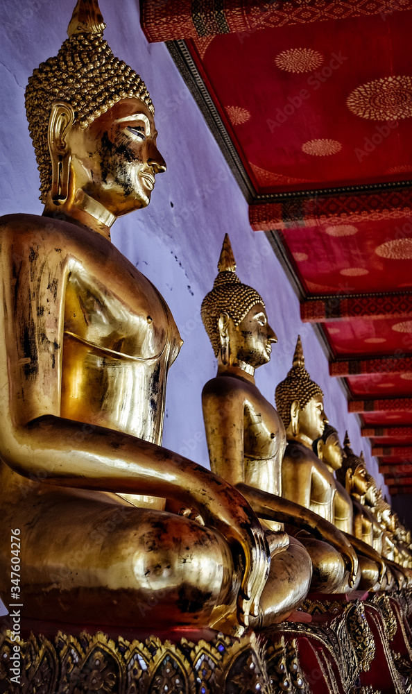 Several golden buddha statue in thailand 