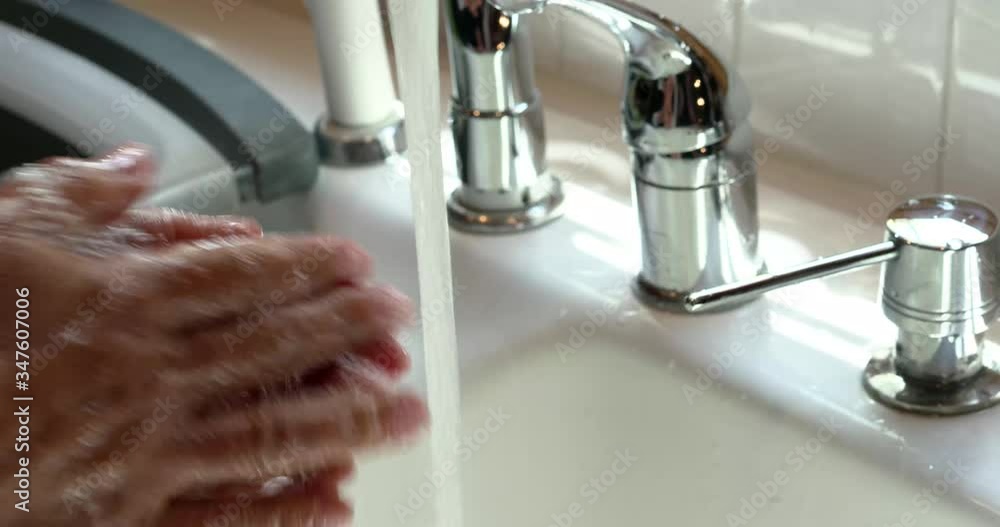 washing hands for 20 seconds with soap and running water close up with natural light washing hands for 20 seconds with soap and running water close up with natural light