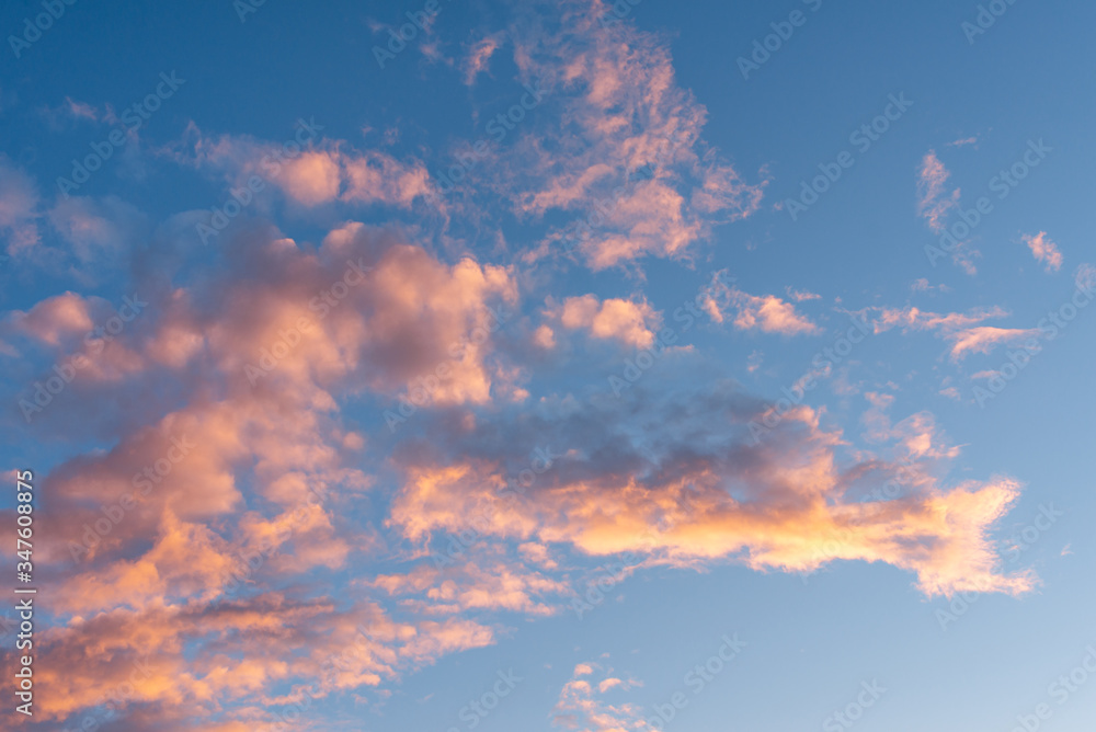 Texture of the sky. Beautiful sunset volumetric clouds. Lilac-golden clouds.