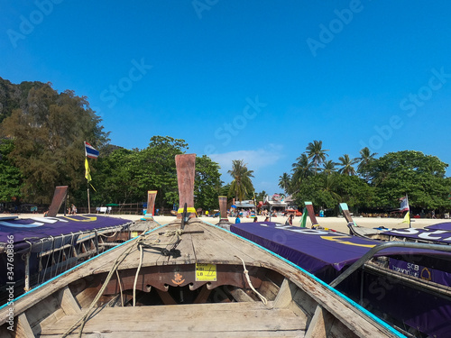 Railay beach, Krabi, Thailand - March 2018. Longtail boats in the coast. © Caminandoelmundo