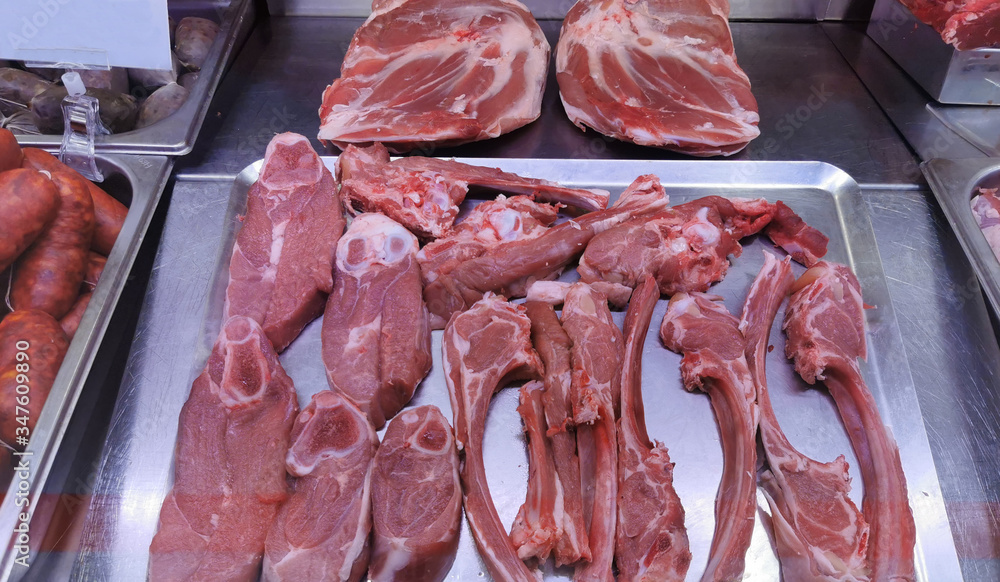
meat laid out on a storefront for sale