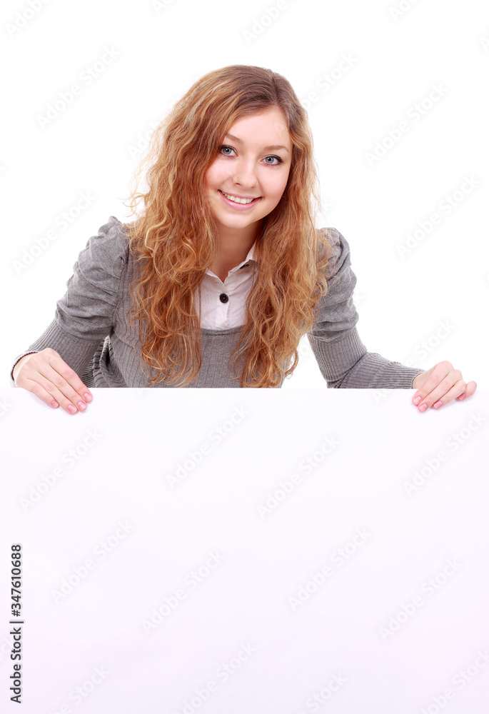 Naklejka premium woman holding sign - Portrait of a beautiful woman holding a blank billboard.