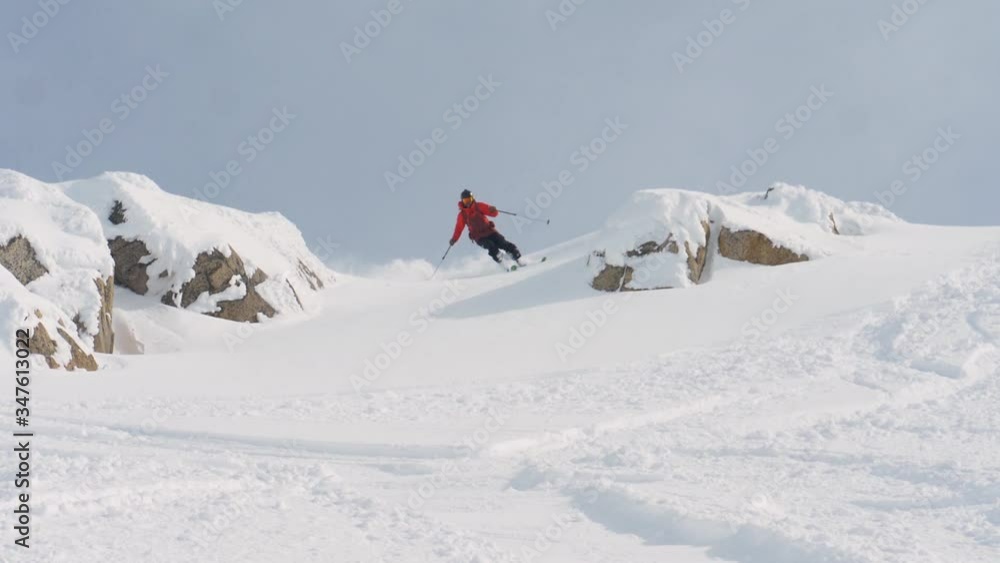 Skier descending in Powder Snow Skier descending in Powder Snow