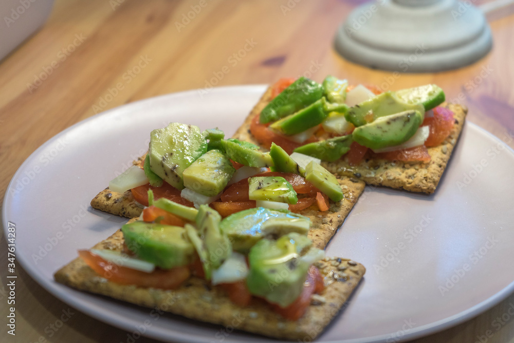 healthy toast with tomato avocado and cheese on wooden table
healthy toast with tomato avocado and cheese on wooden table