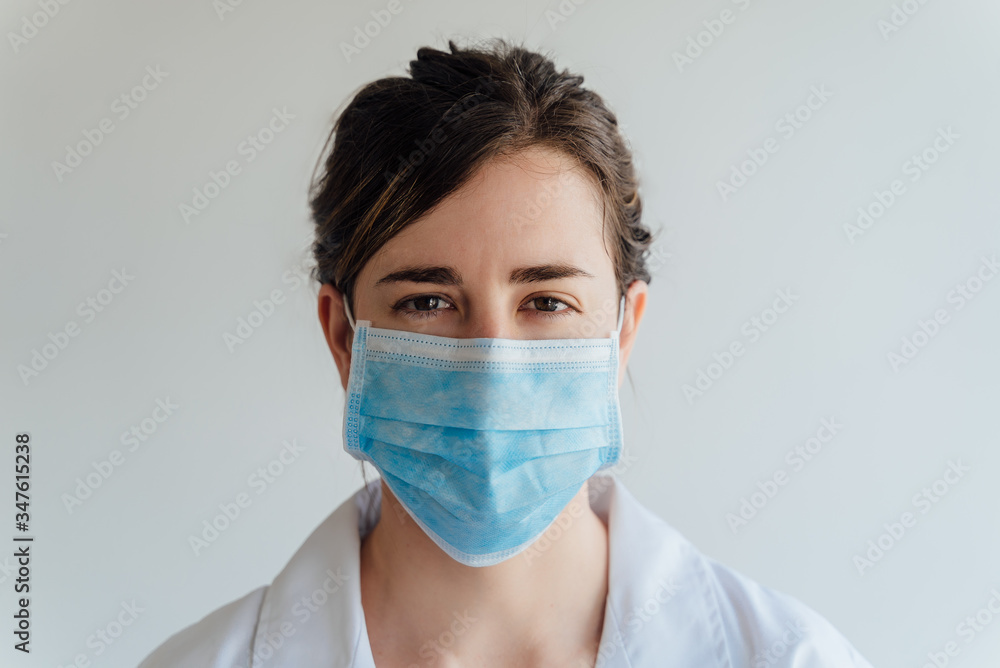 Covid19, coronavirus, healthcare and doctors concept. Portrait female doctor in medical mask and white coat, look after patients checking lungs, consulting how prevent caught virus Covid19, coronavirus, healthcare and doctors concept. Portrait female doctor in medical mask and white coat, look after patients checking lungs, consulting how prevent caught virus