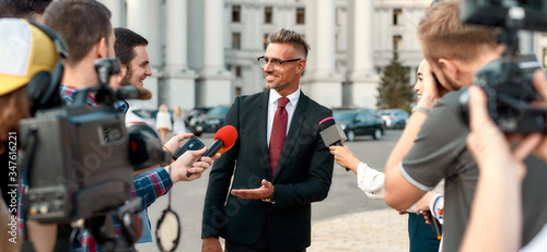 Waiting for the answers. Journalists conducting interview of politician. Journalism industry, live streaming concept. © Svitlana