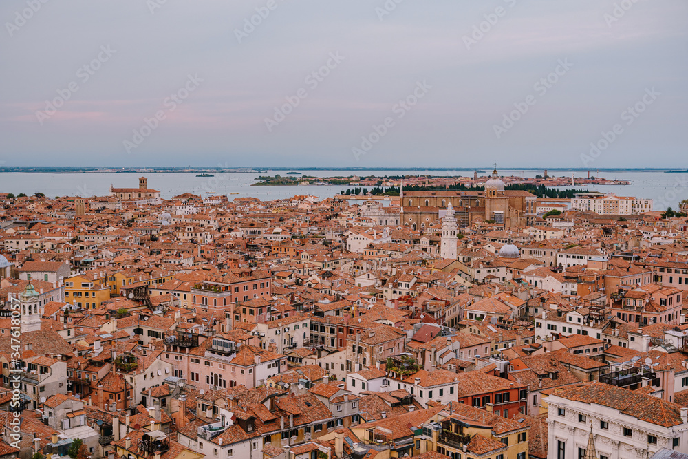 Panoramic views of the city and the Cathedral of Santi Giovanni e Paolo and the Catholic Church Parish of St. Mary the Beautiful from the head of the bell tower in St. Mark's Square in Venice, Italy
