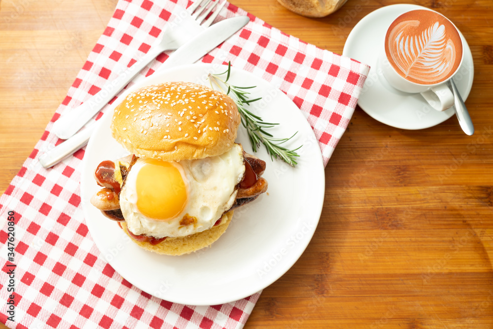 overhead shot of fried breakfast American sausage egg tomatoes roll coffee quick tasty first healthy big portion