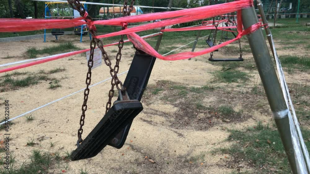 Close Up of Swing Blocked Off at Park Because of Coronavirus (Covid-19) Spread Prevention Measures Close Up of Swing Blocked Off at Park Because of Coronavirus (Covid-19) Spread Prevention Measures