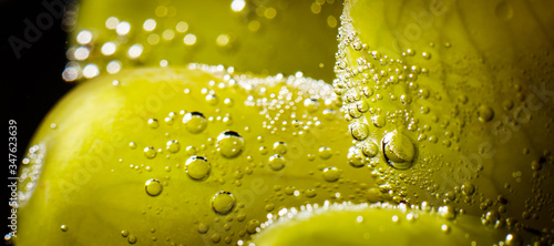 Wide fruit background with grapes and bubbles of the water close up