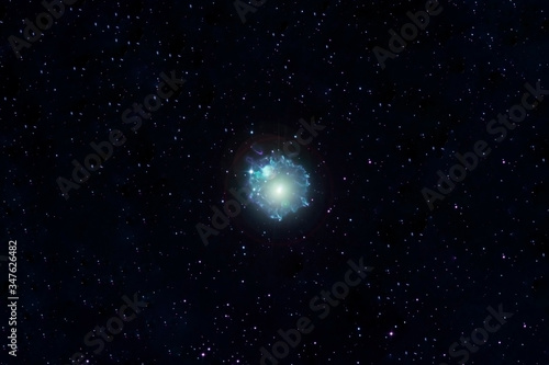 A blue galaxy with stars in deep space. Elements of this image were furnished by NASA.