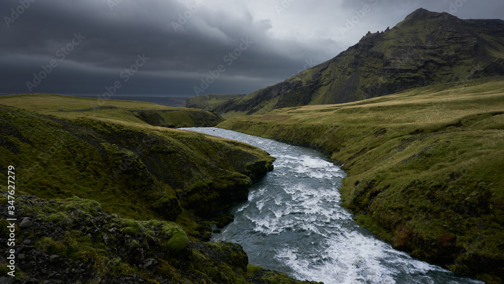 Hiking trail bordering the skogafoss waterfall Hiking trail bordering the skogafoss waterfall