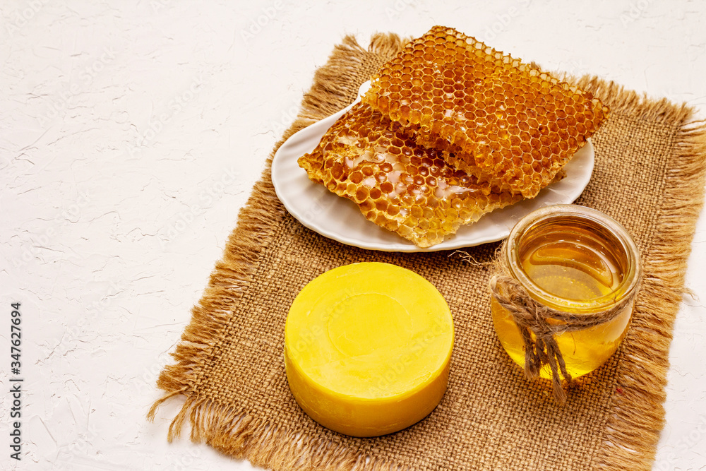 Spa concept. Self care with honey and honeycombs. Natural organic cosmetics, homemade product, alternative lifestyle Spa concept. Self care with honey and honeycombs. Natural organic cosmetics, homemade product, alternative lifestyle
