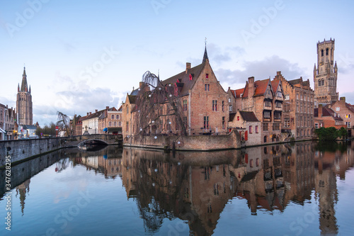 Bruges, Belgium iconic medieval houses, towers and Rozenhoedkaai canal. Classic postcard view of the historic city center. Often referred to as The Venice of the North. West Flanders province, Belgium