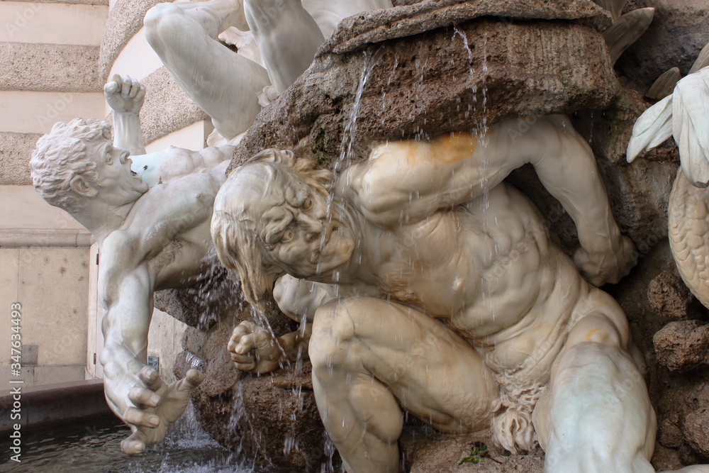 Plastic pose and dramatic expression in this fountain at the entrance of Palace Hoffburg, Wien Plastic pose and dramatic expression in this fountain at the entrance of Palace Hoffburg, Wien